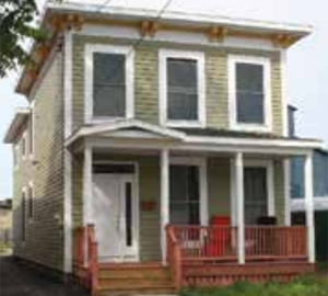 This house at 318 Marcellus St. in Syracuse was abandoned. Its rehabilitation included a new porch and Victorian front, helping revitalize the historic Salt District area. (Home HeadQuarters)